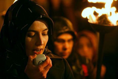 A protester from Mazlumder, a human-rights organization, speaks into a microphone in Istanbul, January 26, 2008, during a demonstration to protest against a ban on the wearing of the Islamic headscarf in universities and in certain public buildings. Turkish President Abdullah Gul said on Friday he backed the Islamist-rooted government's proposal to lift a ban on the wearing of the Islamic headscarf in universities, a move opposed by the secular establishment. REUTERS/Fatih Saribas (TURKEY)